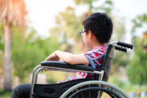 A child in a wheel chair